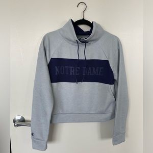 Under Armour crop pullover with Notre Dame detail. Size medium.